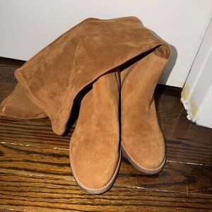 Tan knee high suede short heeled boot.